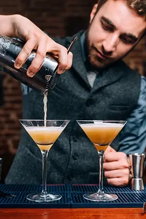 Bartender pouring fancy drink
